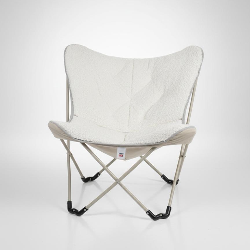 White butterfly chair on a plain studio background